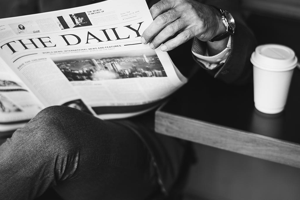 man holding newspaper