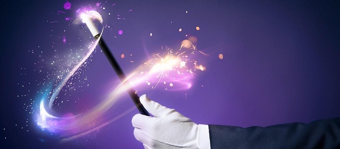 gloved magician swinging wand