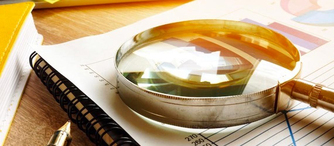 image of a magnifying glass on paper